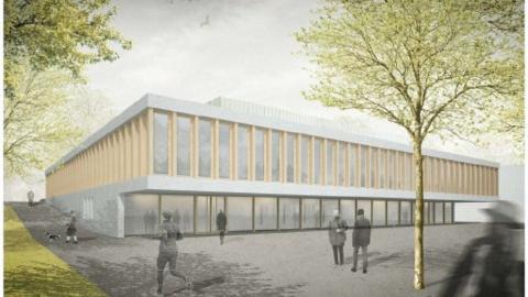 Ein großes Gebäude umgeben von Fußgängern.