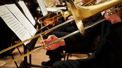 Zu sehen sind mehrere Posaunenspieler.